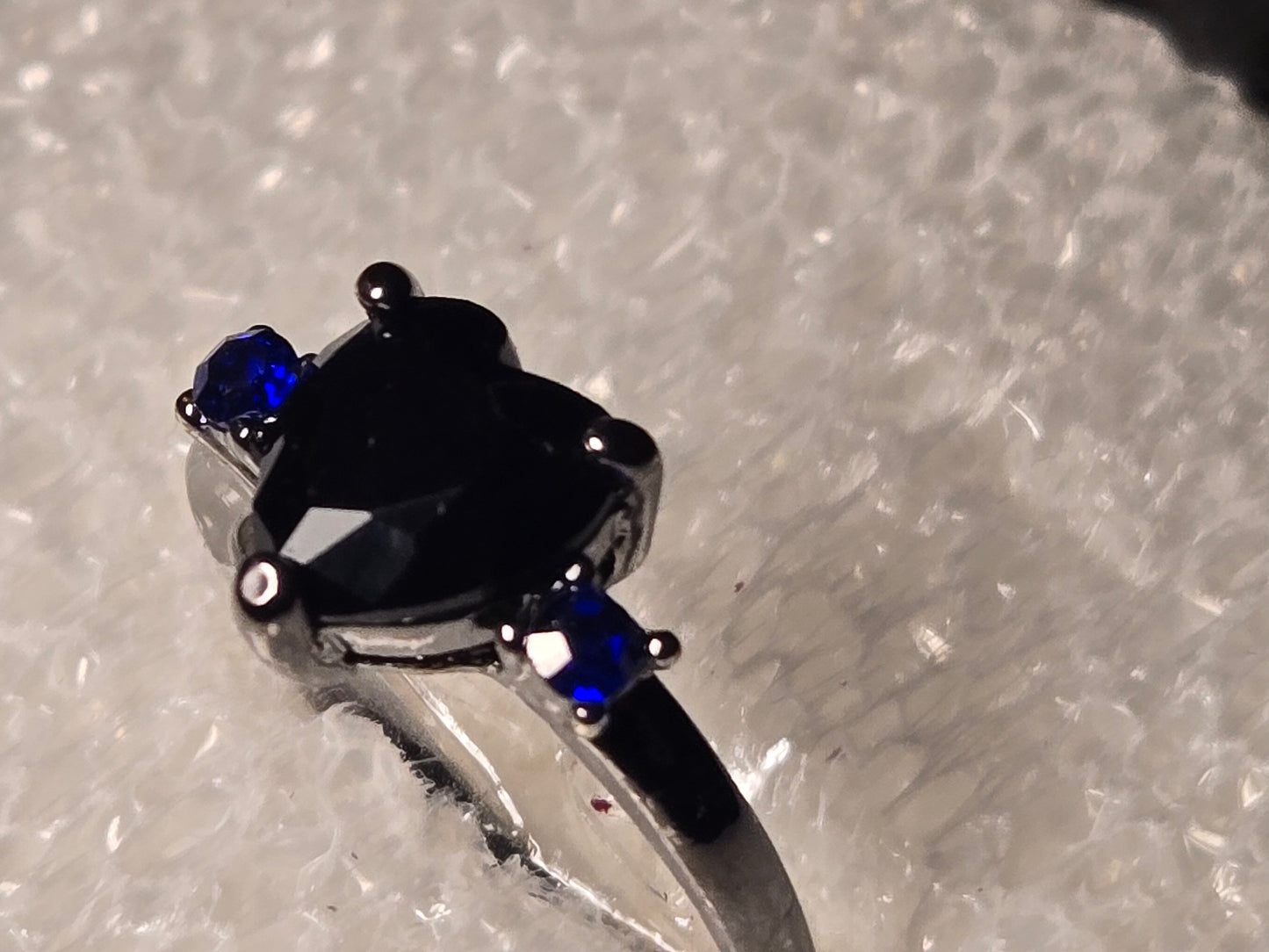 Black heart with blue diamonds on side