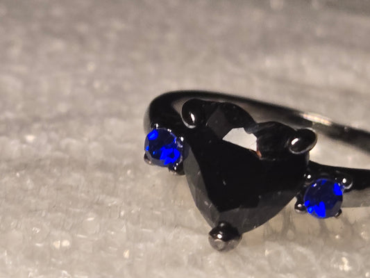 Black heart with blue diamonds on side