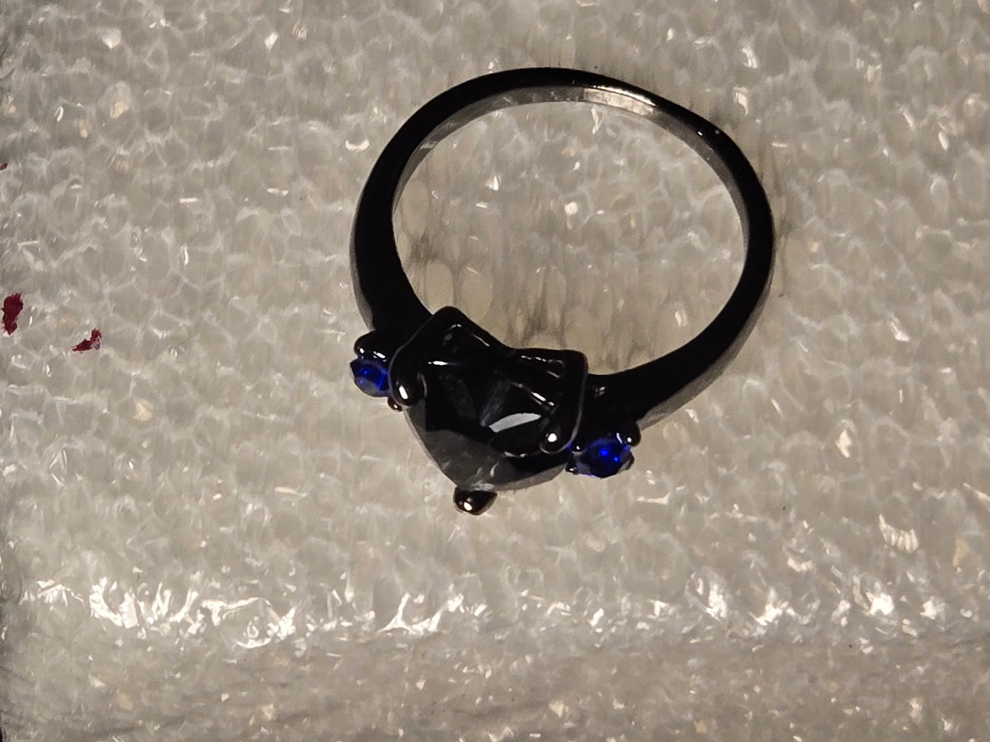 Black heart with blue diamonds on side